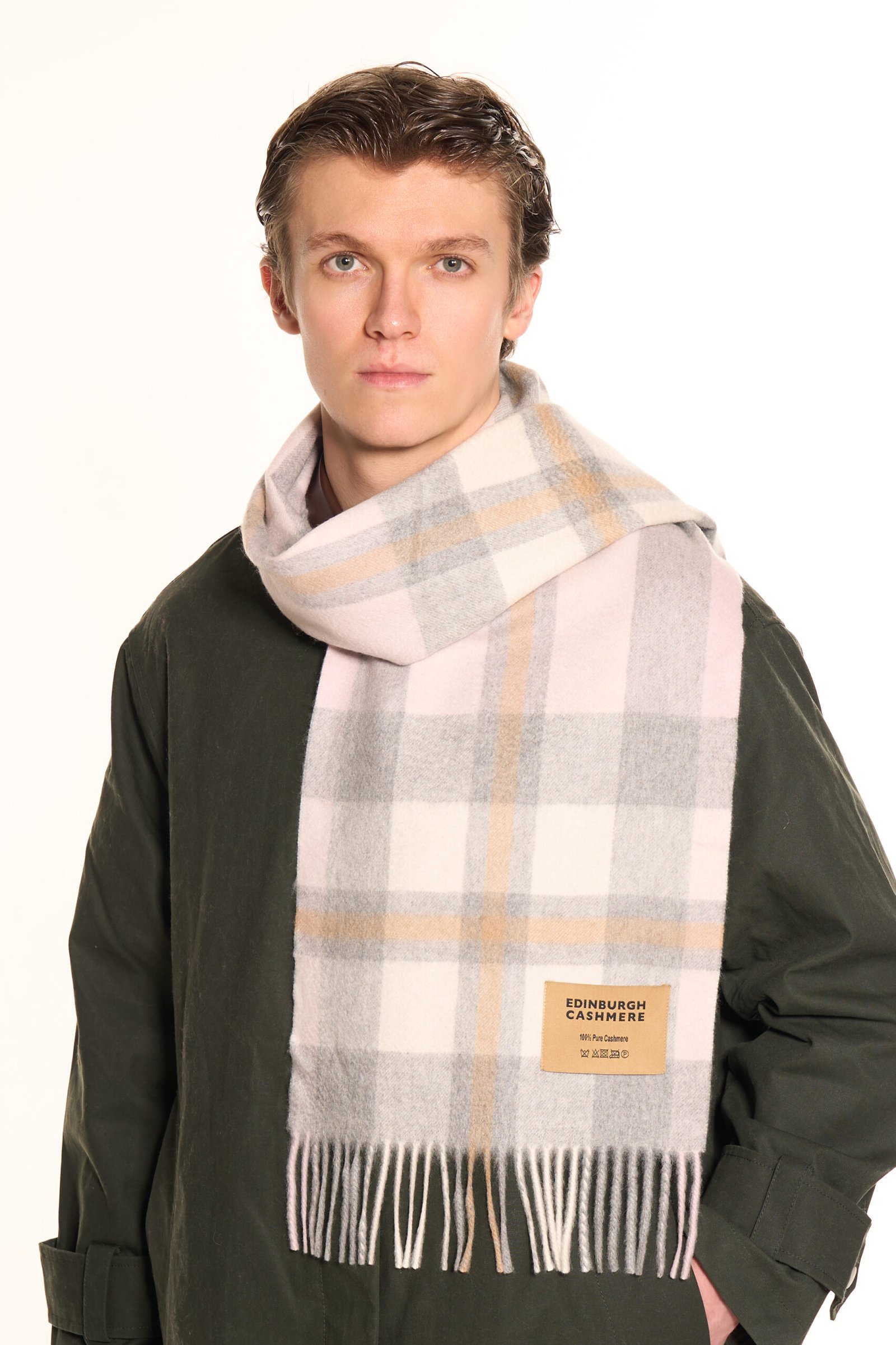 Hand touching an Edinburgh Cashmere DC Scott Cashmere Scarf